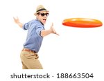 Young man throwing a frisbee disk isolated on white background