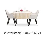 Round restaurant table with a cloth set for two persons isolated on white background
