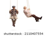 Elderly man looking at a woman and swinging on wooden swings isolated on white background