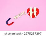 Small photo of Magnet attracts romance relationship couple.Metaphor symbolise as subconscious mind send energy law of attraction. Subconscious mind send the vibration. Attract healthy romance, love, relationship.