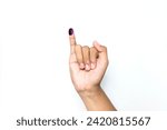 Small photo of The little finger of a man's hand with blue ink patches isolated on a white background. blue ink spots from the fingers of Indonesia's presidential election (presidential election).