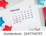 President's Day. Date on calendar February 20, 2023. Red, blue and white star balloon, decorations on white background. Happy Presidents Day, calendar. Flat lay, top view, copy space