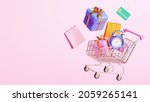 miniature shopping cart with... | Shutterstock . vector #2059265141