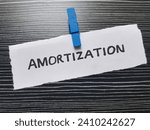 Small photo of Amortization written on black background.