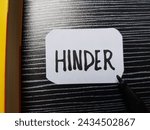Small photo of Hinder writting on table background.