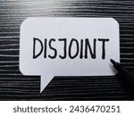 Small photo of Disjoint writting on table background.