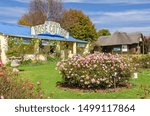 Small photo of Dullstroom, South Africa - May 24, 2019: Naledi Drive with Rose Cottage B&B and Restaurant and Silk Store in one of the highest towns in the country