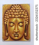 Small photo of bizzlink Citra Raya 03 July 2023 - a golden yellow Buddha painting displayed in a bizzlink Citra Raya warehouse office