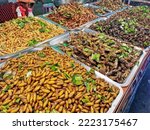 Fried insects meal worms for snack.
Fried grasshoppers is food insect. Thai snacks popular on street foods
