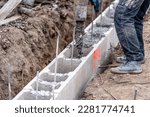 concreting the foundation of the house from the lost formwork, construction of a family house