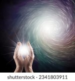 Small photo of Channeling vortex healing vibes bringing light into the darkness - male cupped hands with star light vortex energy formation and copy space for message