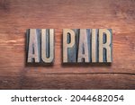 au pair, commonly used French phrase meaning - a young foreigner who does domestic chores in exchange for room and board