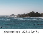 rocky Atlantic Ocean coastline by clear sunny day near Luderitz in Namibia 