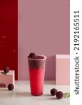 Small photo of bayberry juice on red background，myrica rubra juice