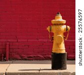 Yellow Fire Hydrant On Red Wall