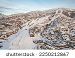 Aerial view of ski resort and mountain town of Steamboat Springs, Colorado with winter landscape and Mt. Werner