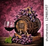 Small photo of Red wine bottle and wine glass with dragan effect