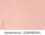 Small photo of Pink cosmetic clay smudged background. Pink shimmering cosmetic texture background. Pink clay cosmetic mask textured smears close up. Cosmetic clay for face and body skin care procedures.