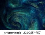 Small photo of Gold Particles In Blue Fluid. Golden sparkling dust particles floating in a blue liquid with green tints, creating fantasy curved patterns and waves. Magic glittering galaxy.