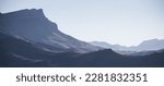 Small photo of Panorama of a mountain landscape with slopes and ridges in the distance on a sunny autumn morning minimalism, tonal perspective of mountain ranges