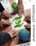 Small photo of Cohesive group of business people forming jigsaw puzzle pieces in environmental awareness symbol as eco corporate responsibility for community and sustainable solution for greener Earth. Quaint