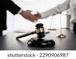 Small photo of Focus gavel symbolize justice on blur background of lawyer colleagues handshake after successful legal deal for lawsuit to advocate resolves dispute in court ensuring trustworthy partner. Equilibrium