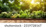 Small photo of The empty wooden table top with blur background of garden. Exuberant image.