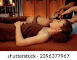 Small photo of Couple customer enjoying relaxing anti-stress head massage and pampering facial beauty skin recreation leisure in warm candle lighting ambient salon spa in luxury resort or hotel. Quiescent