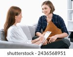 Small photo of Happy patient and psychologist have mental health conversation in clinic with positive emotion while explaining utmost successful work and life to psychologist in home office .
