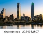 Small photo of Pond at Bicentennial Park in the wealthy Vitacura district and skyline of buildings at financial district, Santiago de Chile
