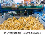   Fruit and other goods at a local market in Krakow Poland. Cantharellus cibarius mushroom stall.