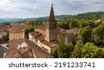 Small photo of Panorama of the medieval town of Sansepolcro, Tuscany, Italy, with St.Francis (San Francesco) Church's bell tower, typical red roof tiles, cloudy sky and tuscanian hills in the distance