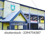 Small photo of Pare Pare, South Sulawesi, Indonesia-25 November 2023 : Gelora BJ Habibi Stadion from outside the arena front view with a yellow building