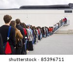 Large group of people waiting in line