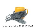 Cup of coffee with scarf isolated on white background