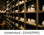 Small photo of bowling shoes organized in cubby shelves bowling alley