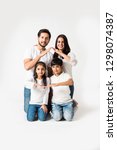 Small photo of Indian family making the home sign over white background. selective focus