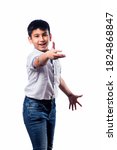 Small photo of Indian small kid posing as if throwing or playing Frisbee or boom rang, standing isolated against white background