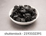 Small photo of Shilajit is an ayurvedic medicine found primarily in the rocks of the Himalayas. selective focus
