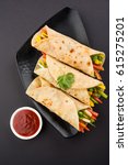 Small photo of Veg Spring Roll OR Wrap also known as Franky, made using Paneer and Vegetables stuffed inside Chapati or Roti. Served with Tomato Ketchup. Selective focus