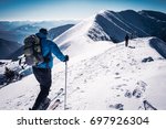 Skialpinists group in european snowy mountains alps, Symbol winter sports, Man with ski at top of the mountain, Concept winter adventure
