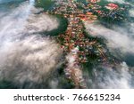 Royalty high quality stock image aerial view of Bao Loc town, Lam Dong, Vietnam. Fog, mountain and city