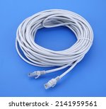 Small photo of Internet data cable isolated on white background. LAN cable patch cord. Network internet cable isolated over blue.