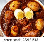 Small photo of Doro Wot or Doro Wat is a tasty Ethiopian dish that is mostly served on religious holidays and occasions