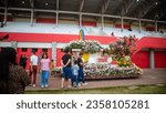 Small photo of TOMOHON, INDONESIA – AUGUST 20, 2023: Tomohon International Flower Festival - TIFF, Cars decorated with flowers to take part in the tournament of flower