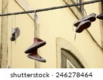 Old Sneakers Hanging From A...