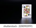 Small photo of card joker baccarat casino game face card dark background card pattens casino card