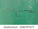 Small photo of WESTON-SUPER-MARE, UK - MARCH 30, 2023: Graffiti in a bus shelter referring to conspiracy theories about 15 minute cities