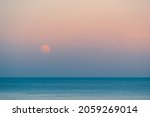 Full Moon Rises Over The Sea At ...