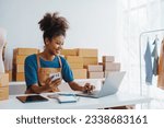 Pretty African American sme business woman working Custom Ecommerce Packaging leading supplier of custom packaging. create a personalised experience, fast production and competitive pricing